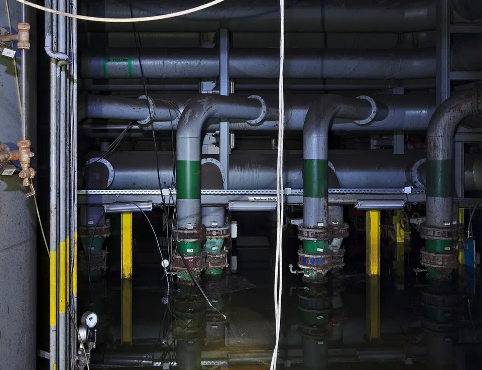 Metal water pipes along a building wall